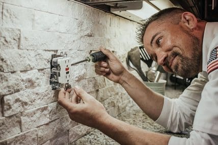 milestone technician installing a GFCI outlet