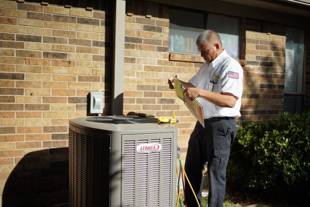 Milestone HVAC technician checks a residential HVAC unit.