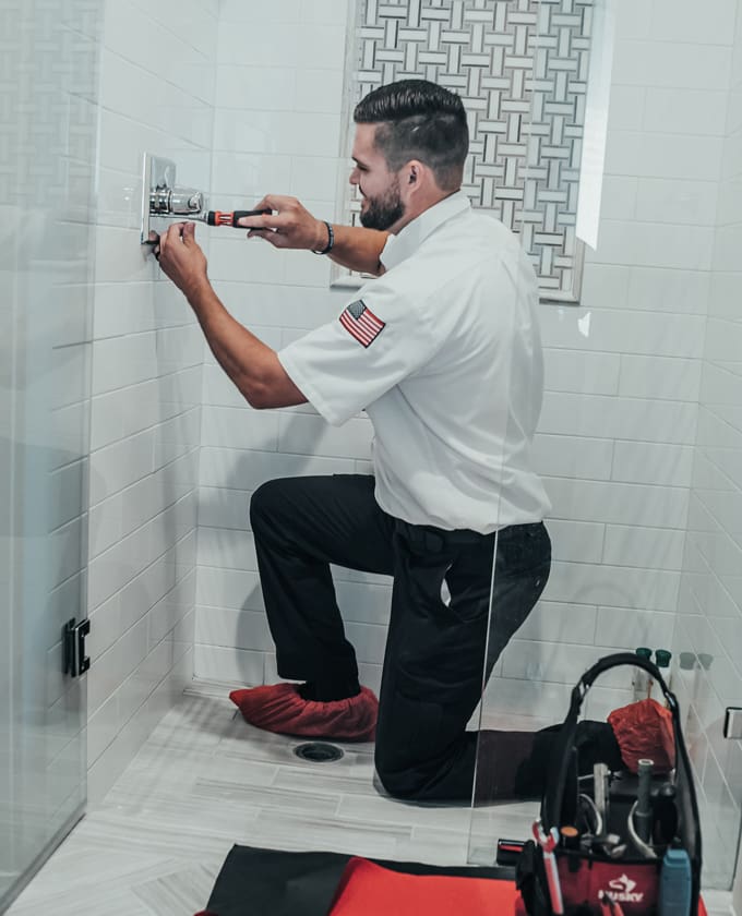 Milestone Technician repairing shower handle